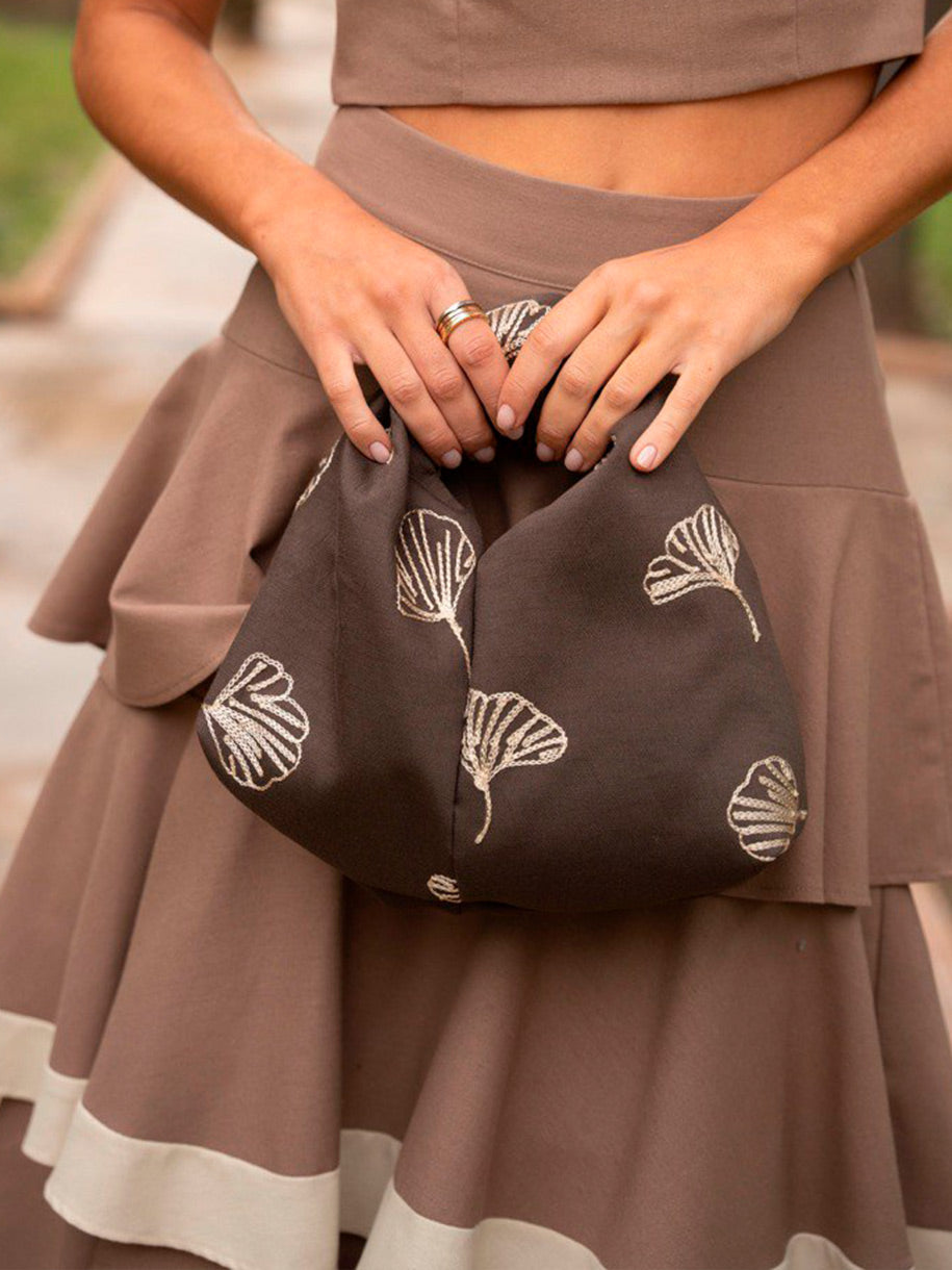 Bolso de invitada con nudo central y estampado